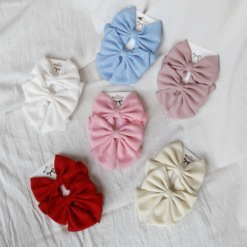 Barrette bébé grand nœud papillon en lin – 10 coloris unis Rose - Chic & Coquette