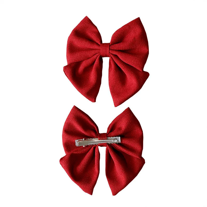 Barrette bébé grand nœud papillon en lin – 10 coloris unis Rouge - Chic & Coquette