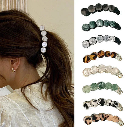 Déclinaisons de couleurs de la pince à cheveux banane en acétate effet marbre - Chic & Coquette